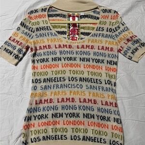 L.A.M.B sweater  zip up neck on the side